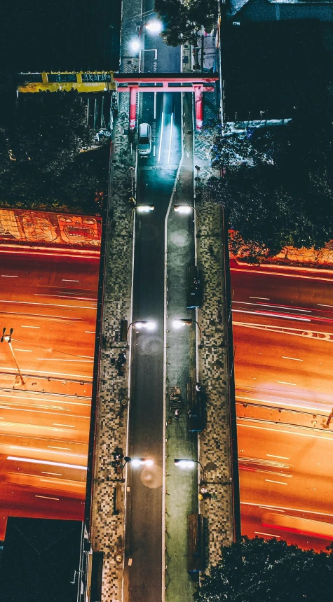 a long exposure picture shows cars driving up a ramp