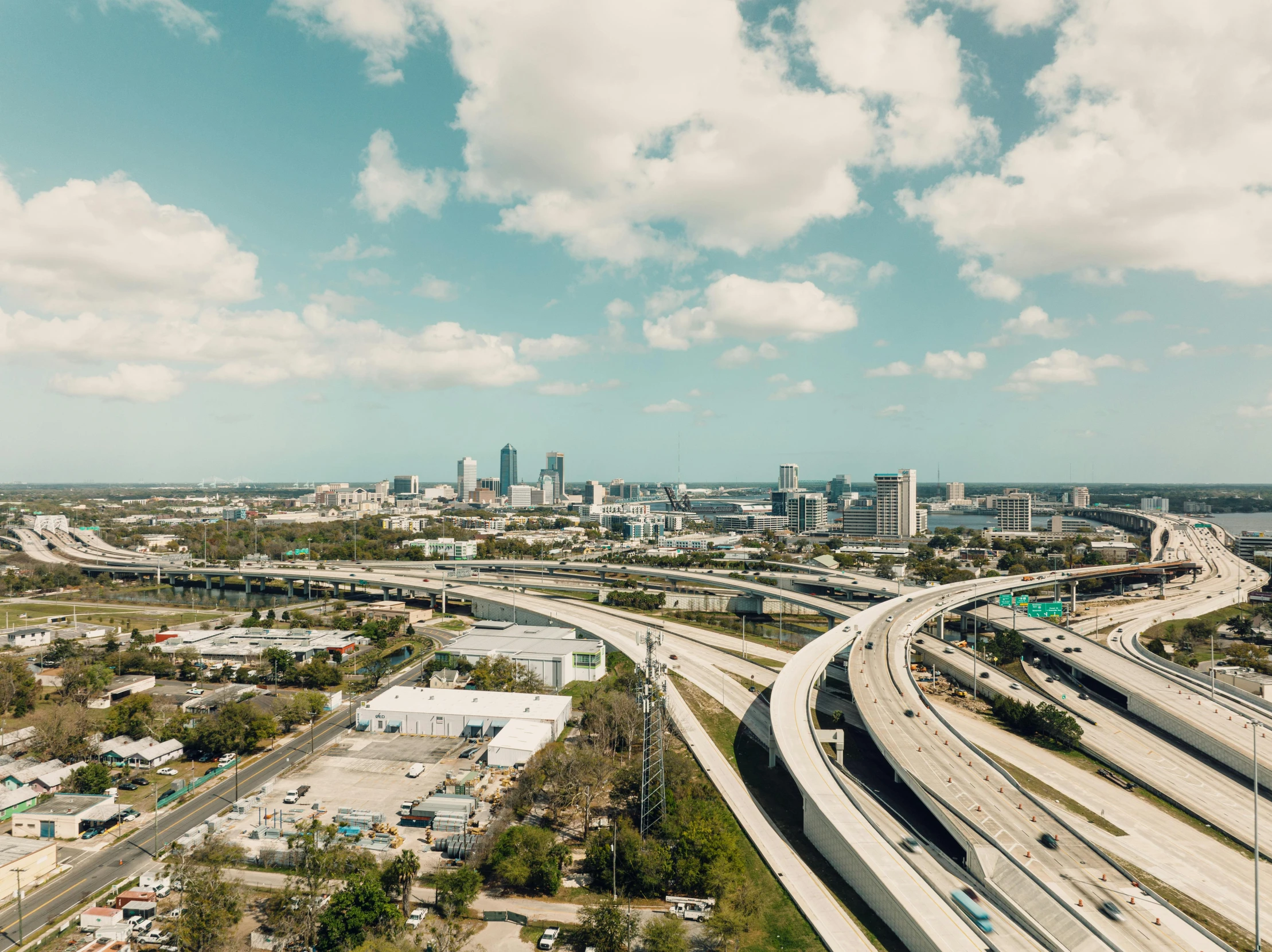 a freeway overpass with lots of cars driving on the highway