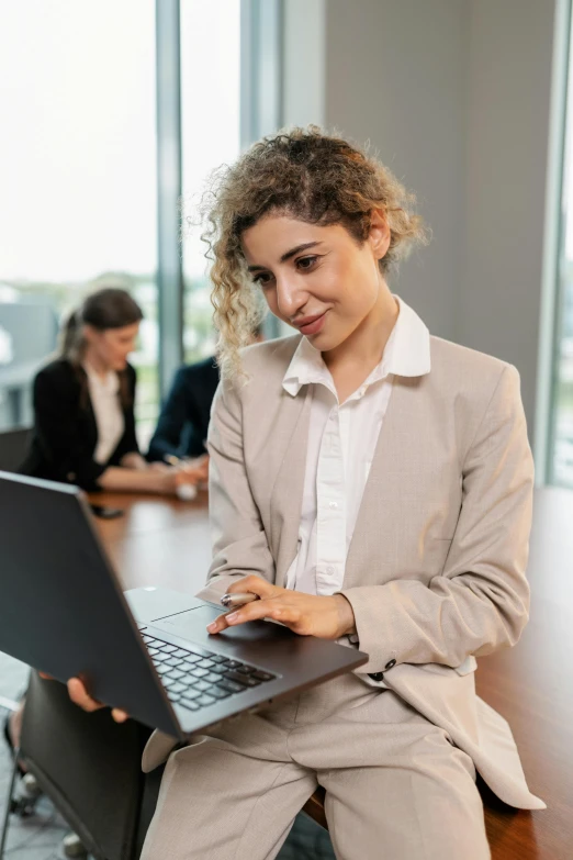 woman at the desk looking at the computer screen