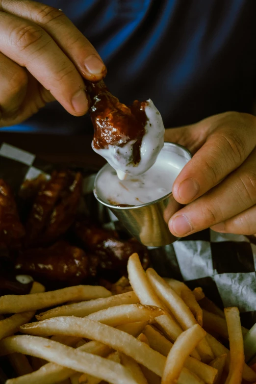 a close up of two people eating food