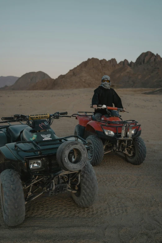 a person that is riding on a atv