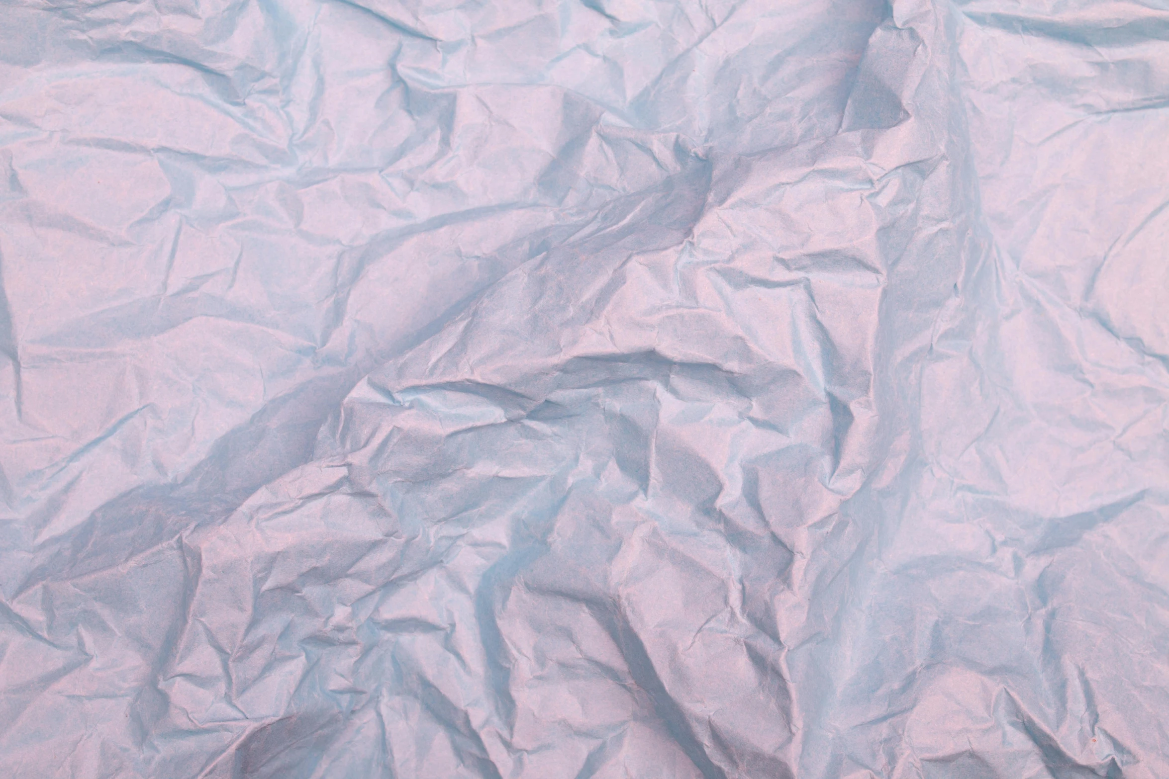 an abstract image of crumpled up blue paper