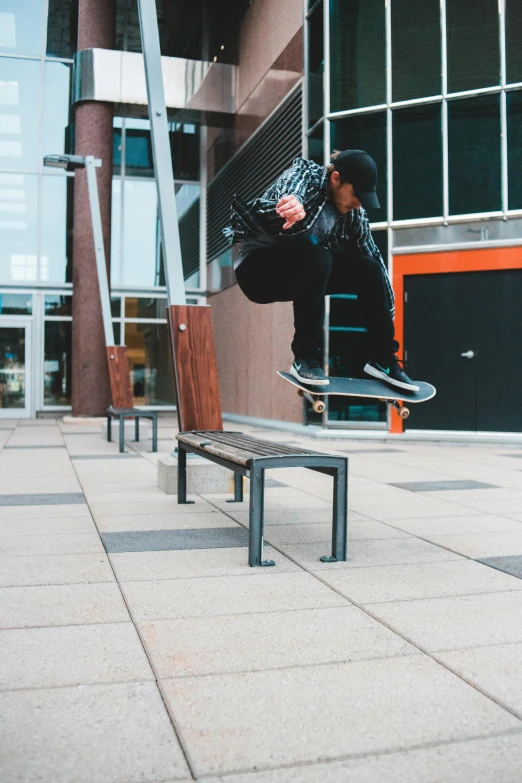 a man does a skateboard trick on a rail