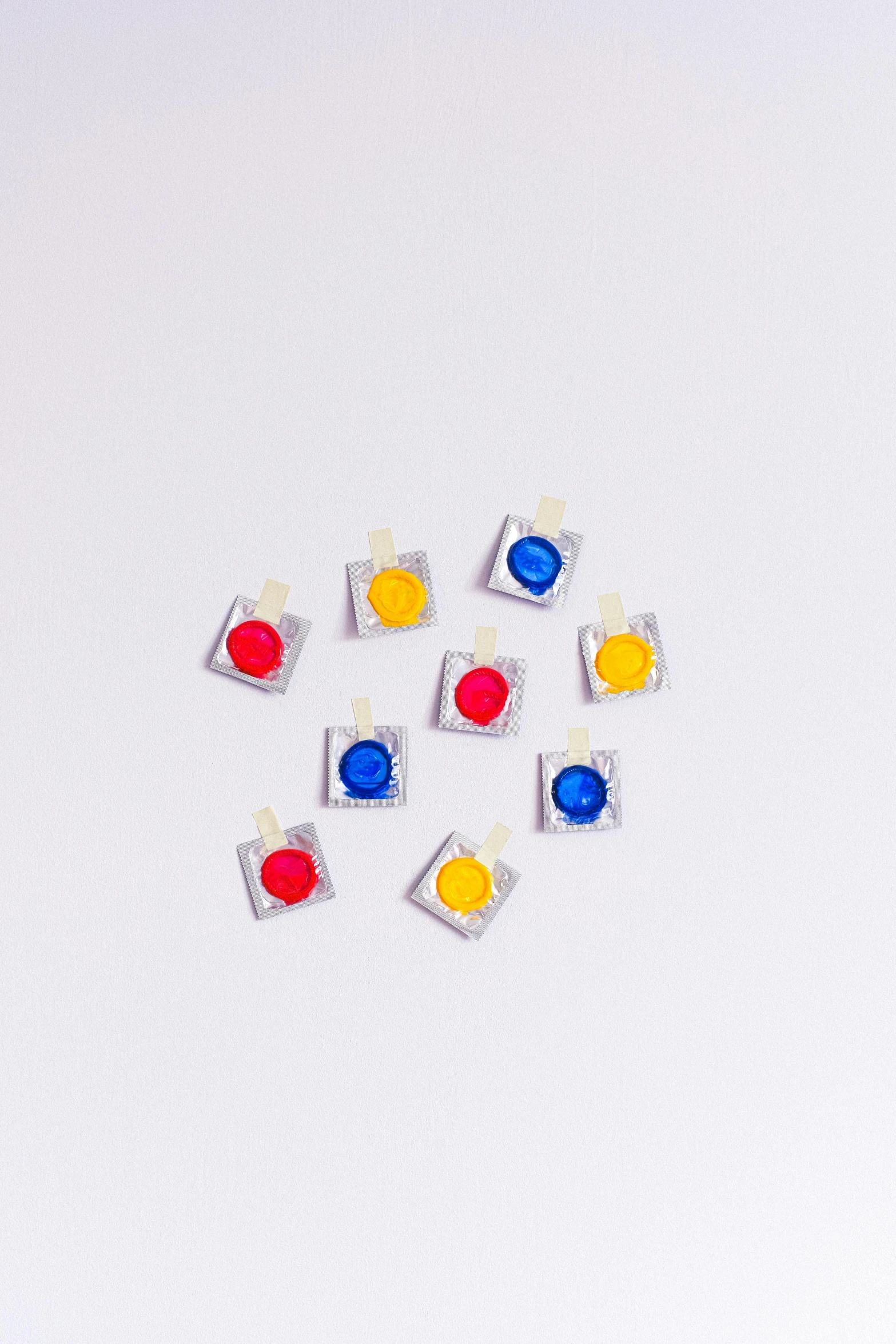 many different colored pins in the shape of squares