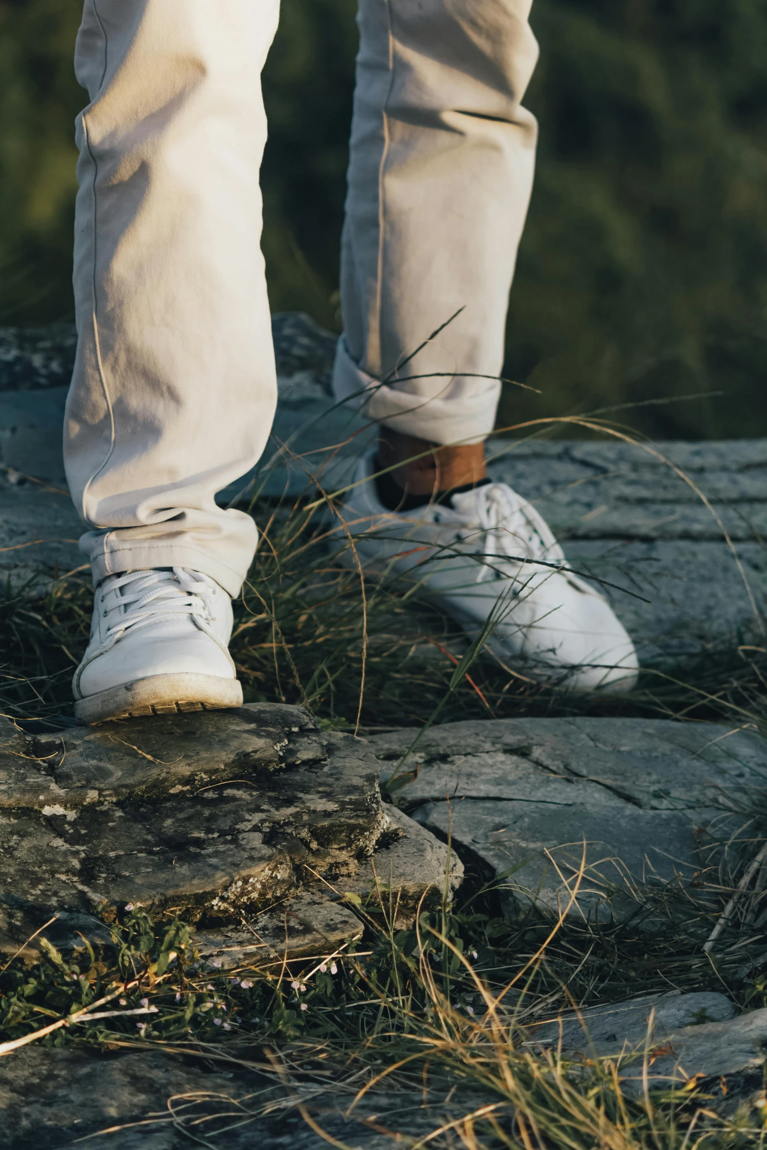 a person with white shoes and jeans on