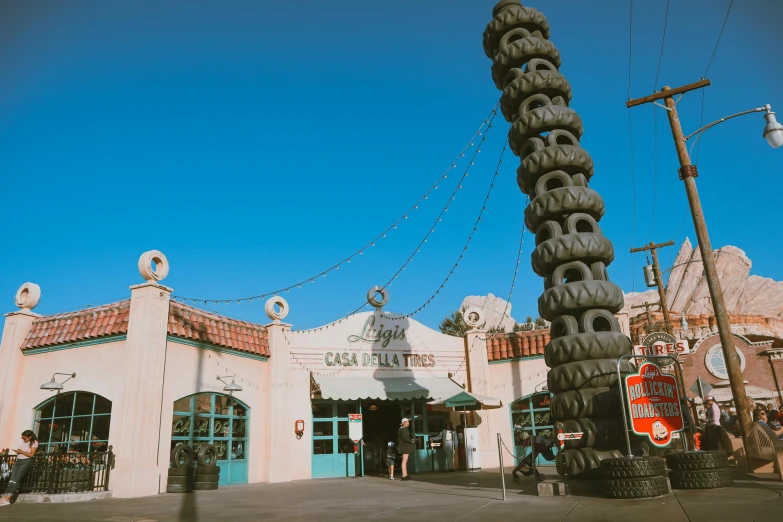 a tall building with a bunch of tires attached to it's side