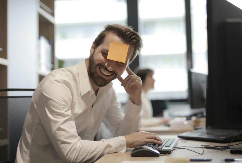 a man with sticky notes on his face