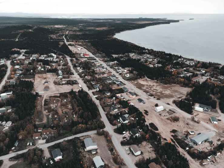 an aerial po of a large residential development on the edge of a lake