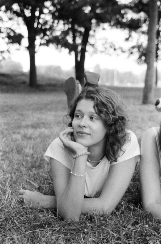 a woman laying on the ground next to another person