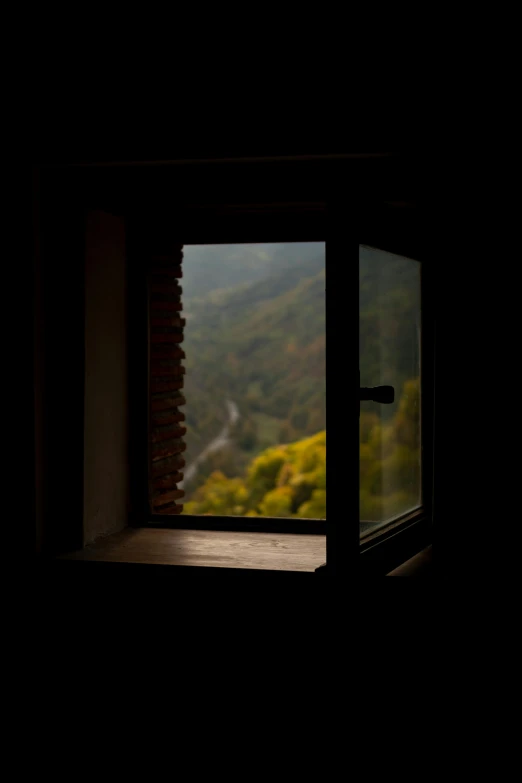 open window with view of mountains through