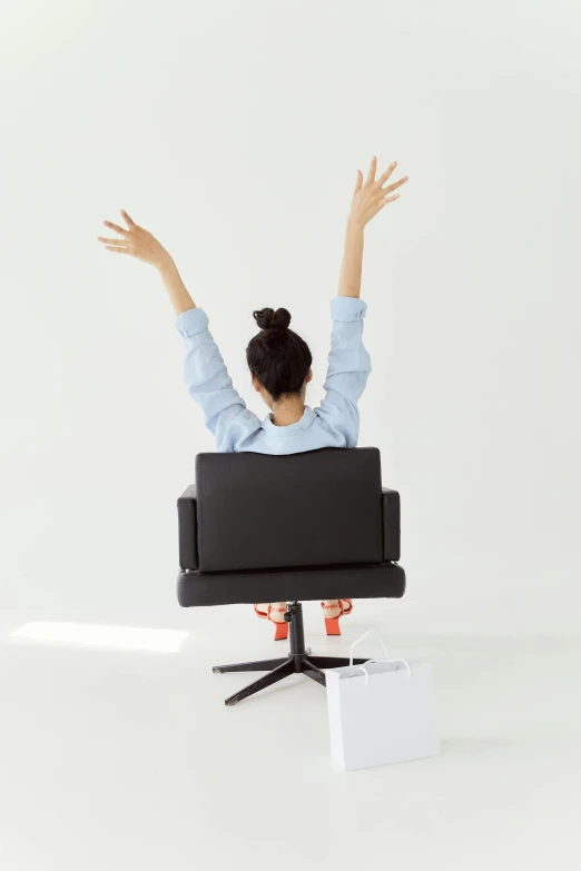 an image of a woman raising her hands