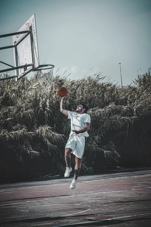 a man in a uniform is playing basketball outside