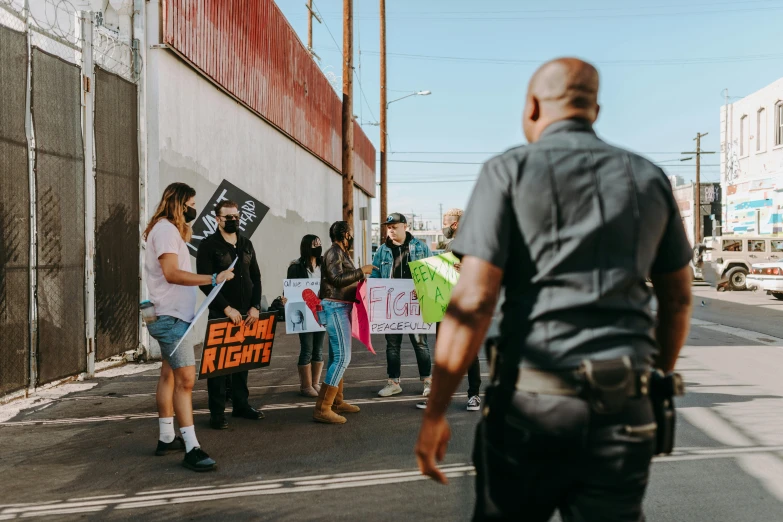 several people in the street holding signs