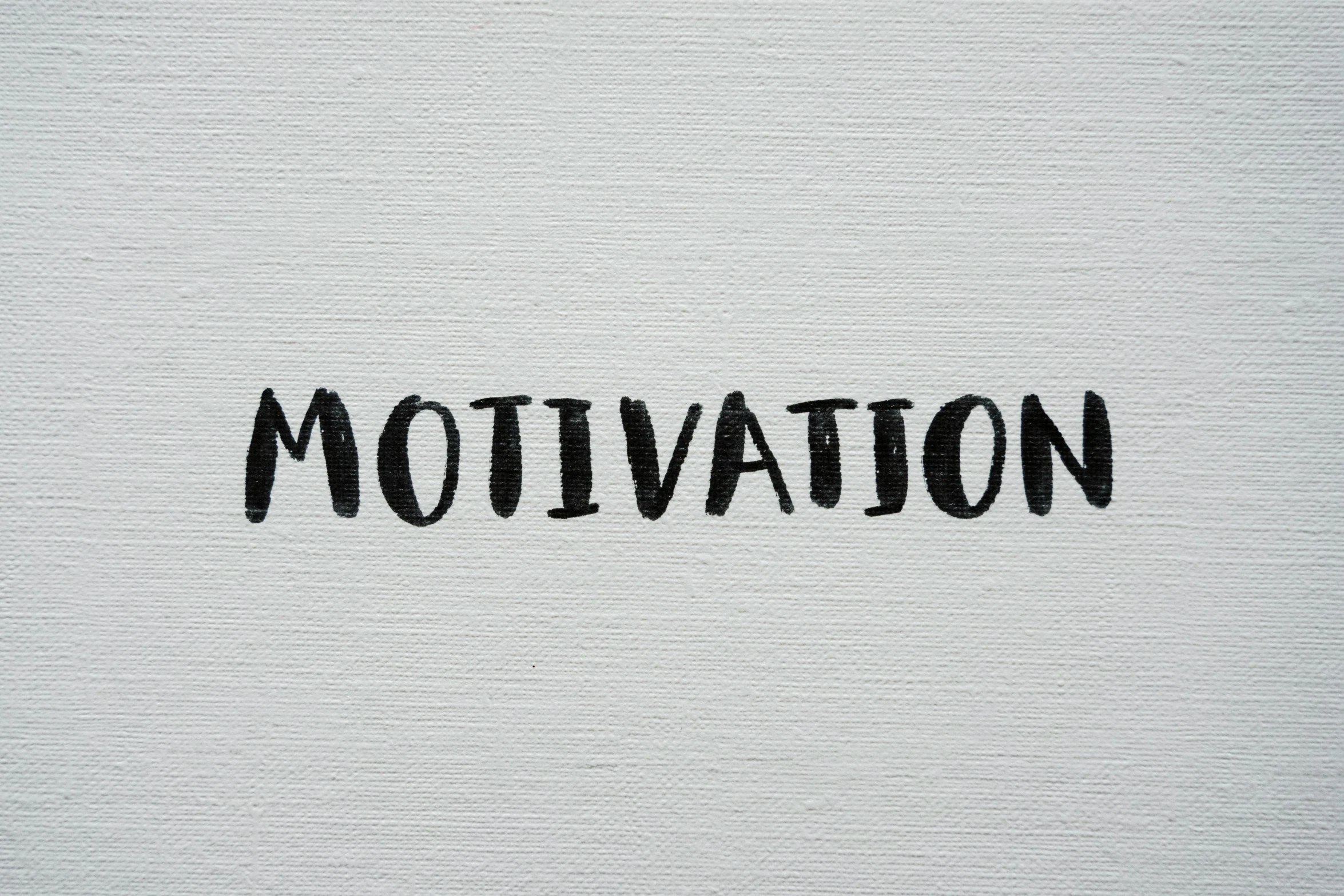 a black and white po with the word motivation written on it