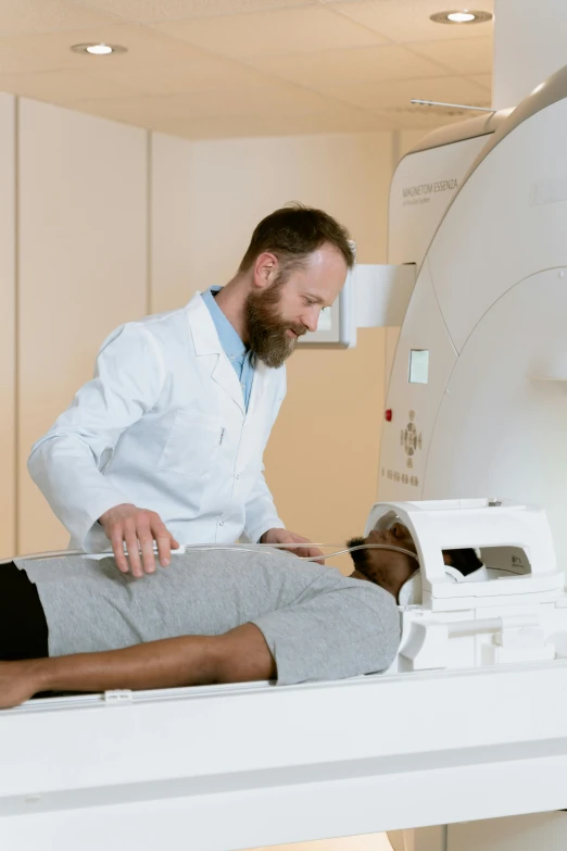 a man getting his head examined by a mri