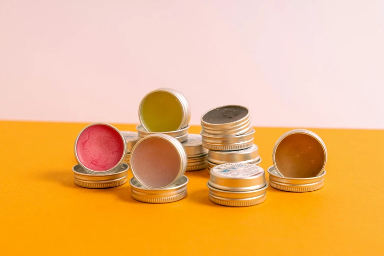 a table topped with stacks of different colored coins