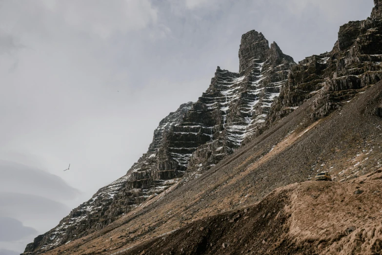 some very tall mountains with snow on them