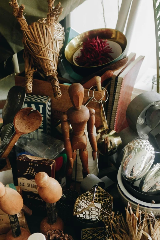 many wooden spoons and wooden items on a table