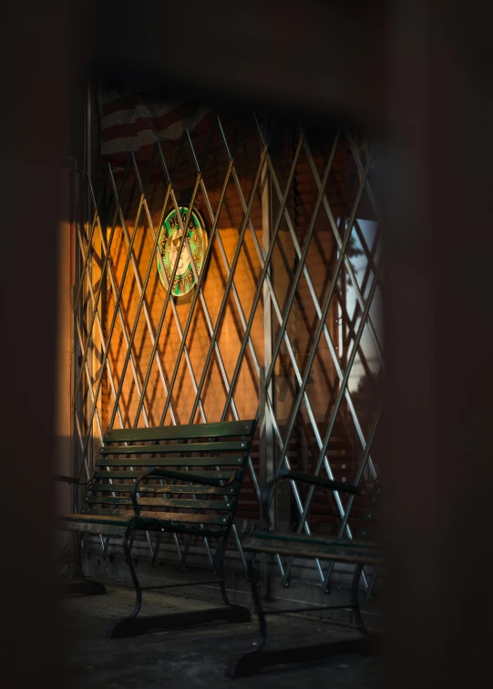 a bench sitting next to a building near a fire escape