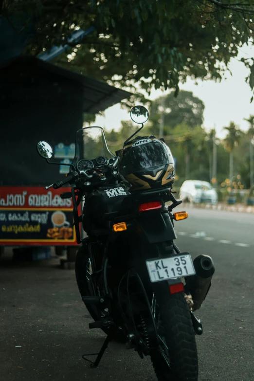a motorcycle parked on the street in front of a bus