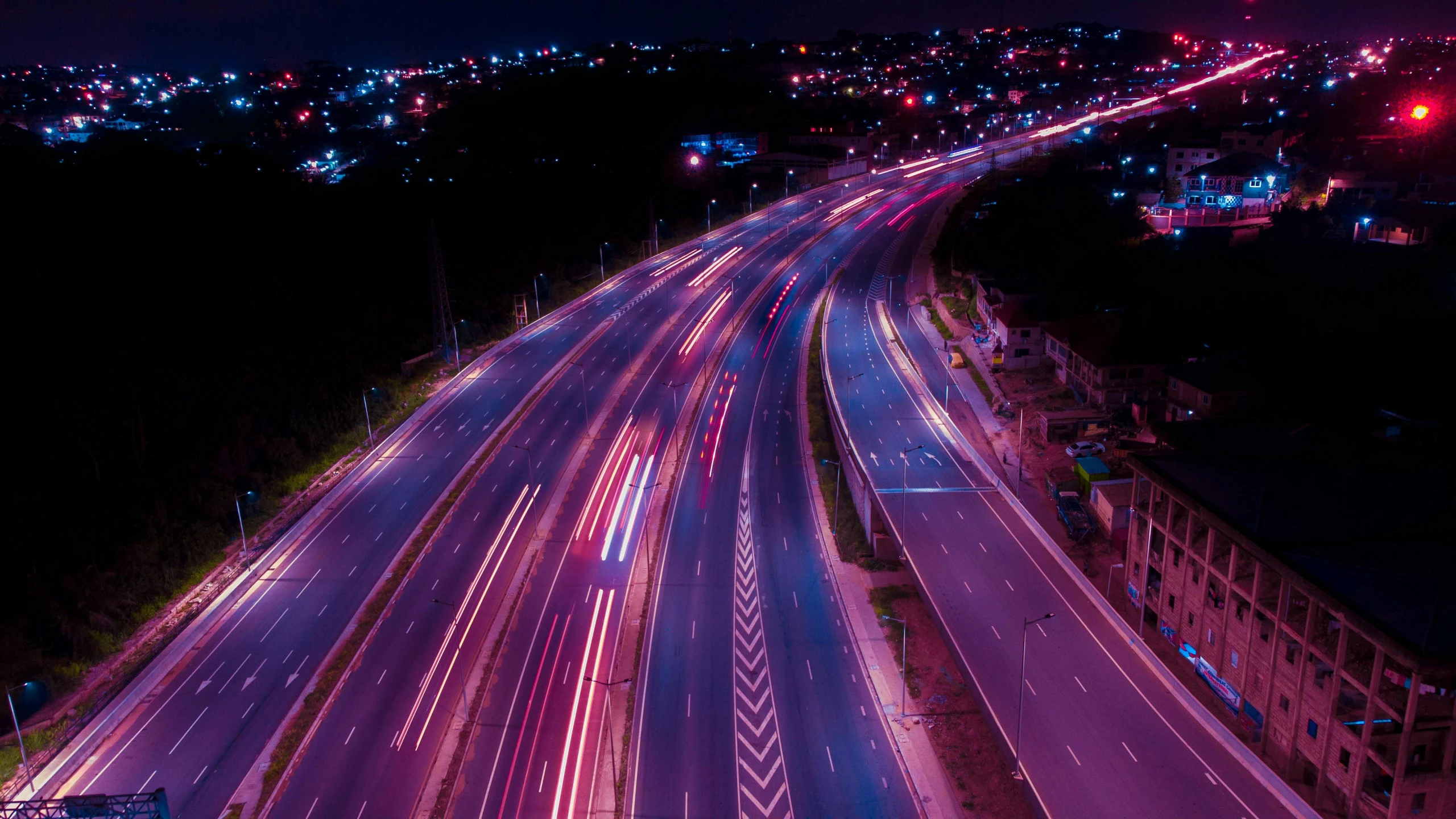 an overhead view of traffic on a busy city highway