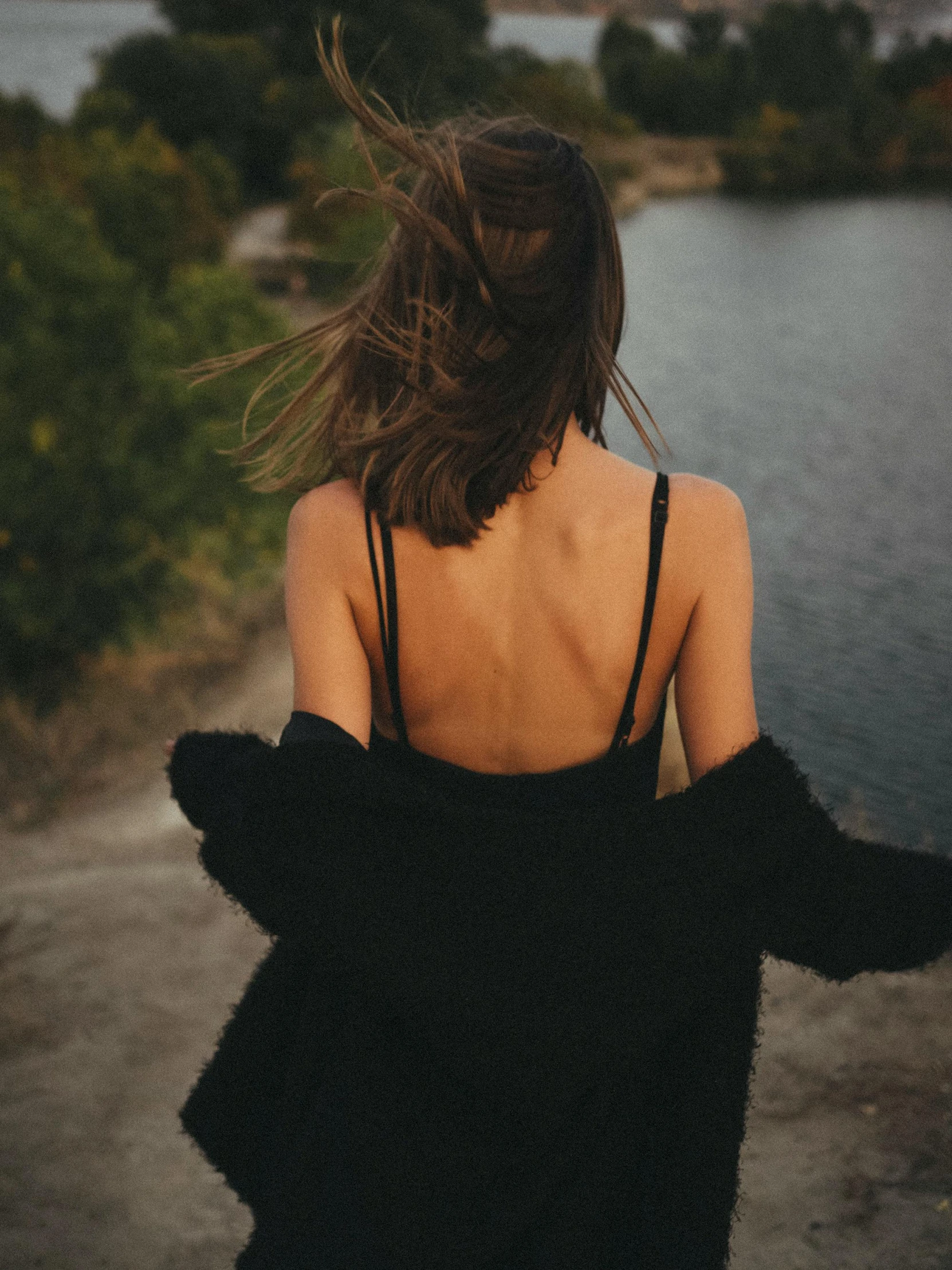 a girl in a dress on a sidewalk