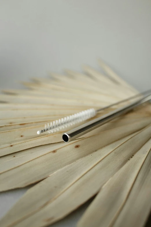 a pair of scissors and two pieces of wood on a table