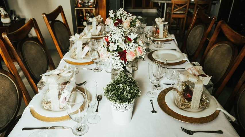 an elaborate set table with fancy place settings