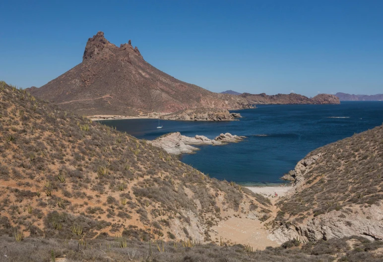 an open area surrounded by hills and lakes