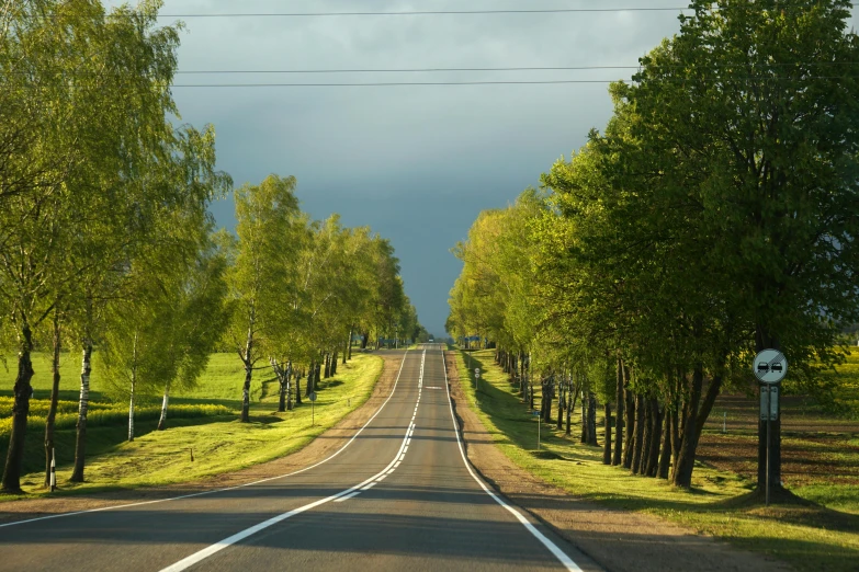 a road that has two lanes and two lanes going to the same place