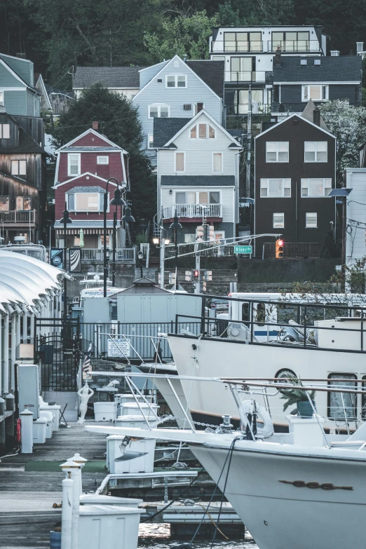 many small boats and houses in the background