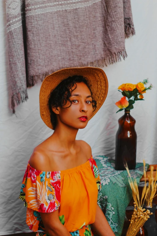 a beautiful young woman wearing a sun hat