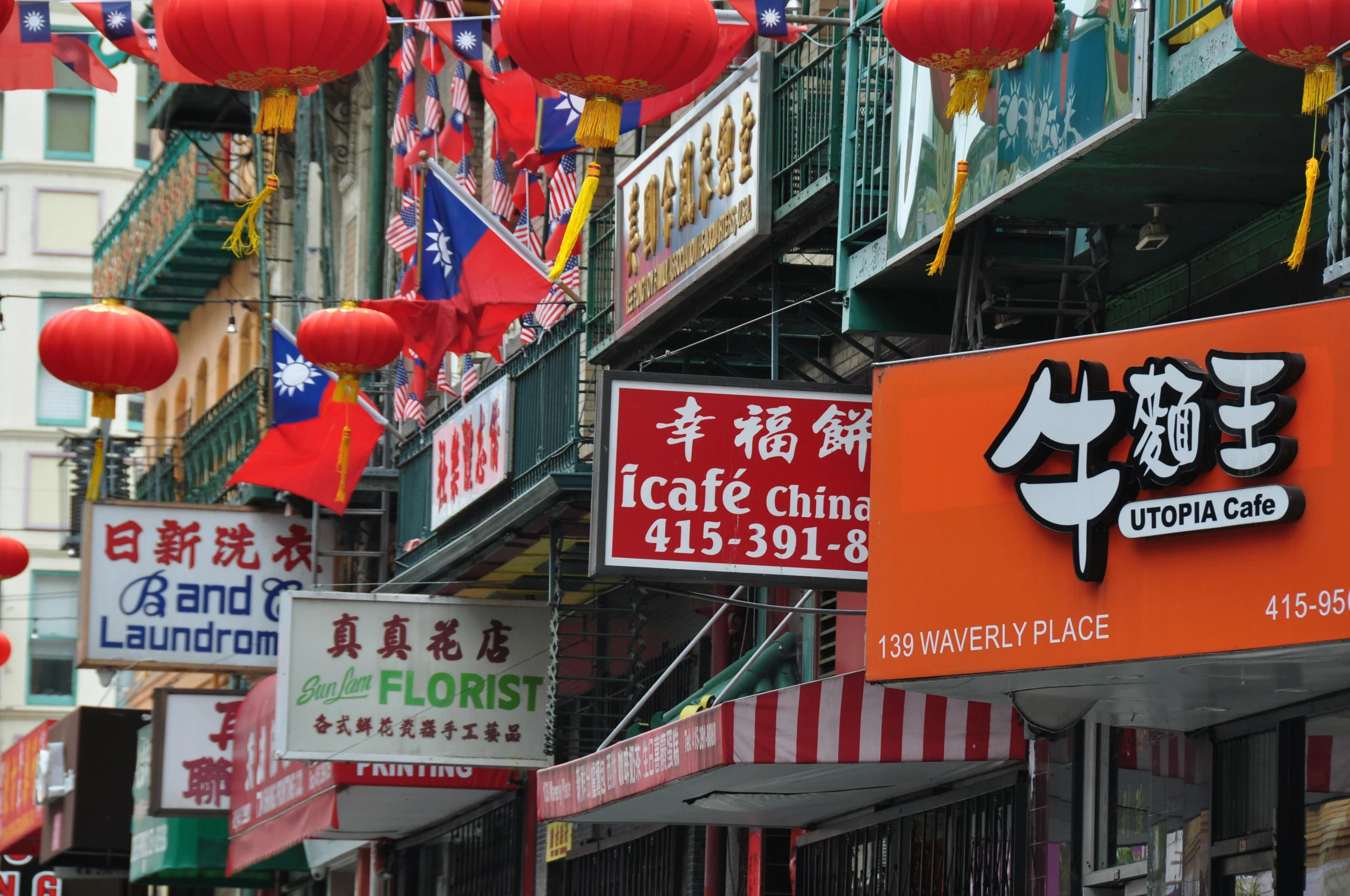 a chinese restaurant has hanging red lanterns above it