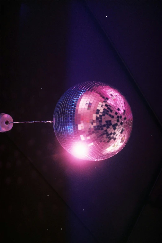 a disco ball has a string on it