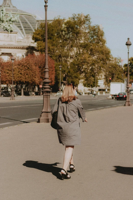 a lady walking down the street in the winter