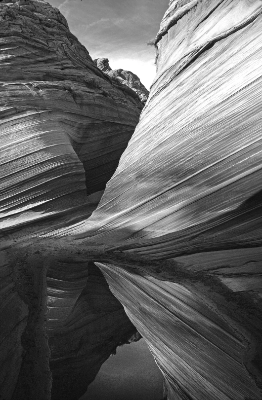 a black and white image of water and rocks