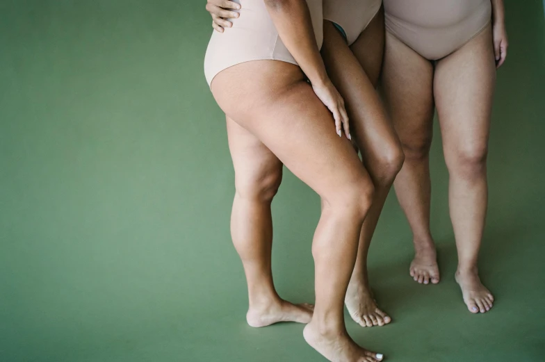 two women in one underwear are standing next to each other