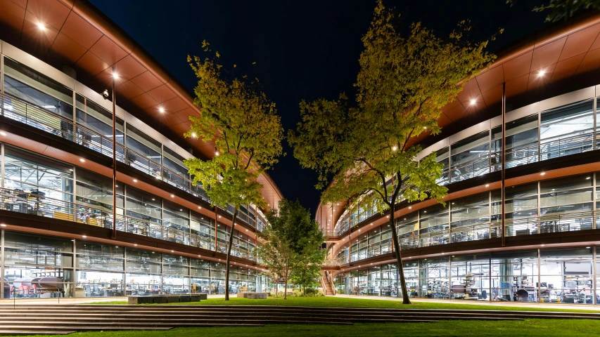 the building has two levels next to the trees