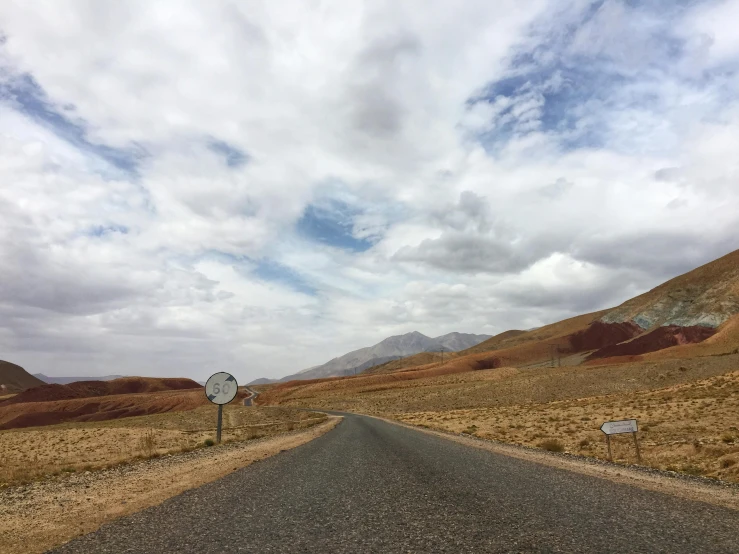 a road winds its way through the mountains