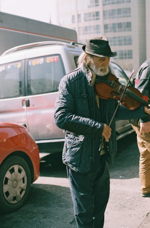 a man plays violin on the street