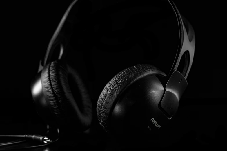 headphones with a black background sitting next to each other