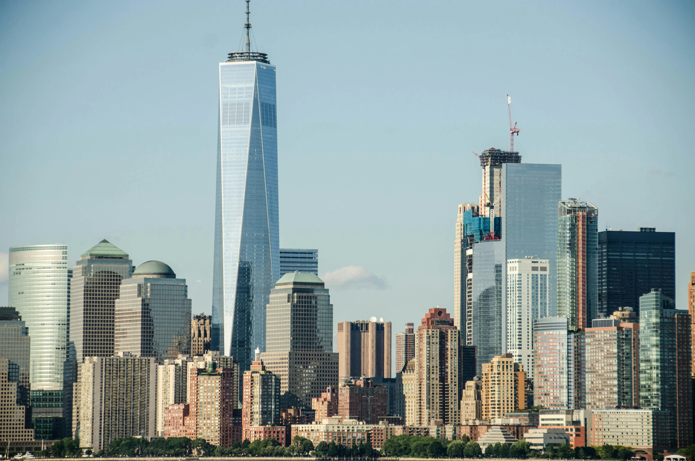 the building is tall and it's surrounded by other high rise buildings