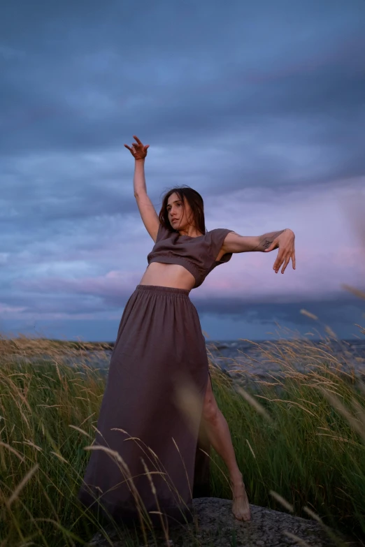 an image of a woman posing in a field