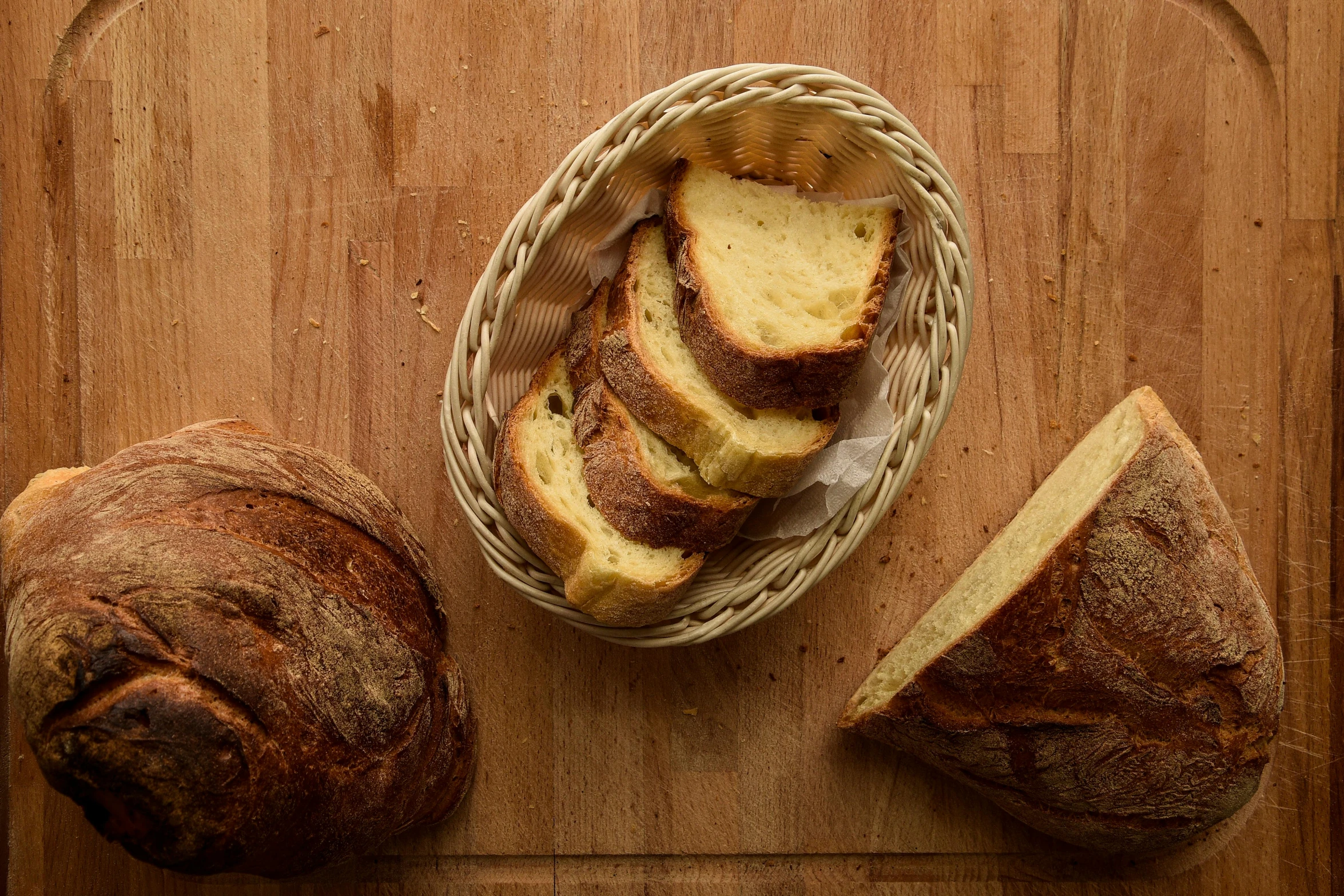 bread and slices of bread placed on a  board