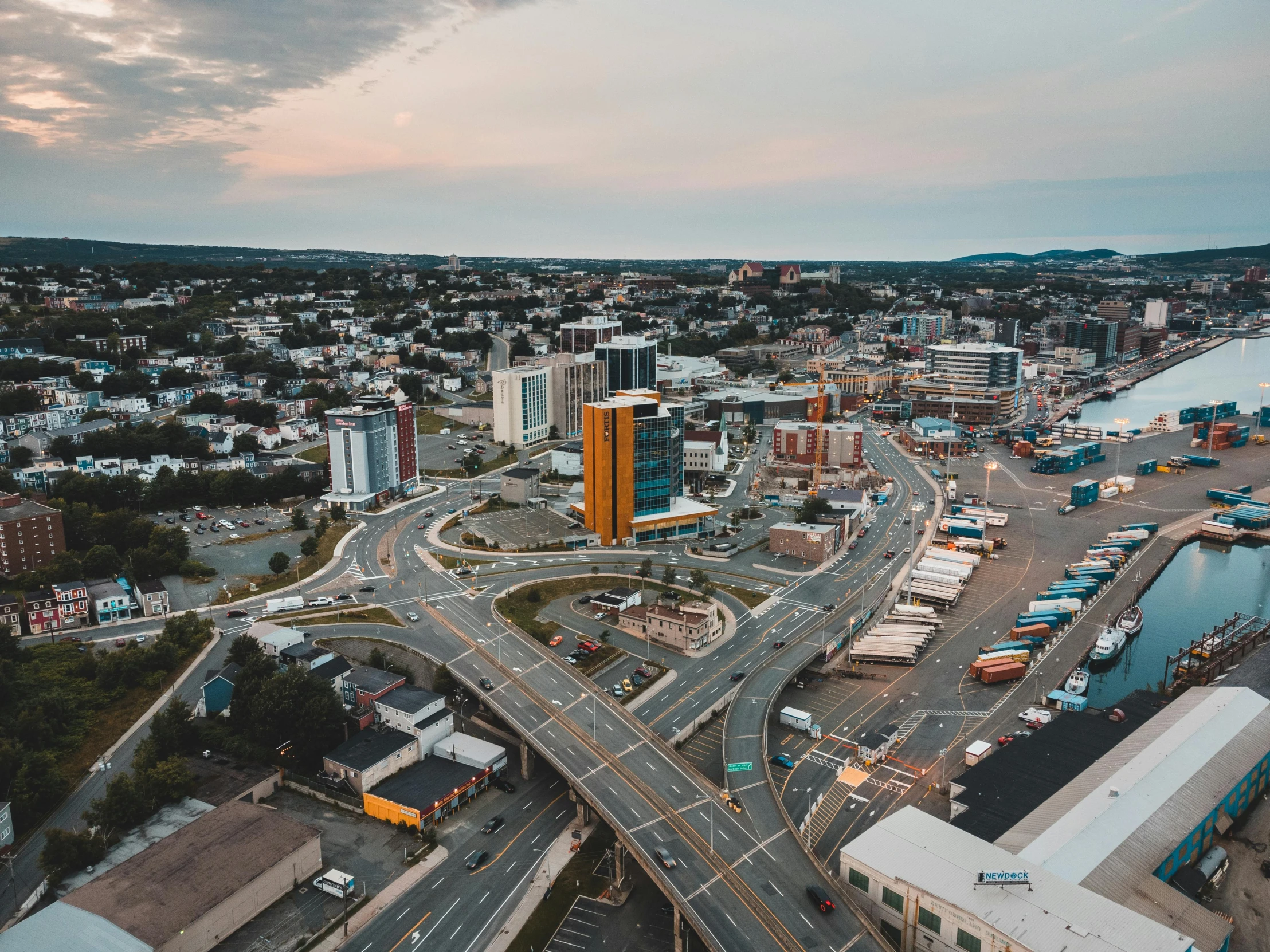 aerial view of a street with many parked vehicles