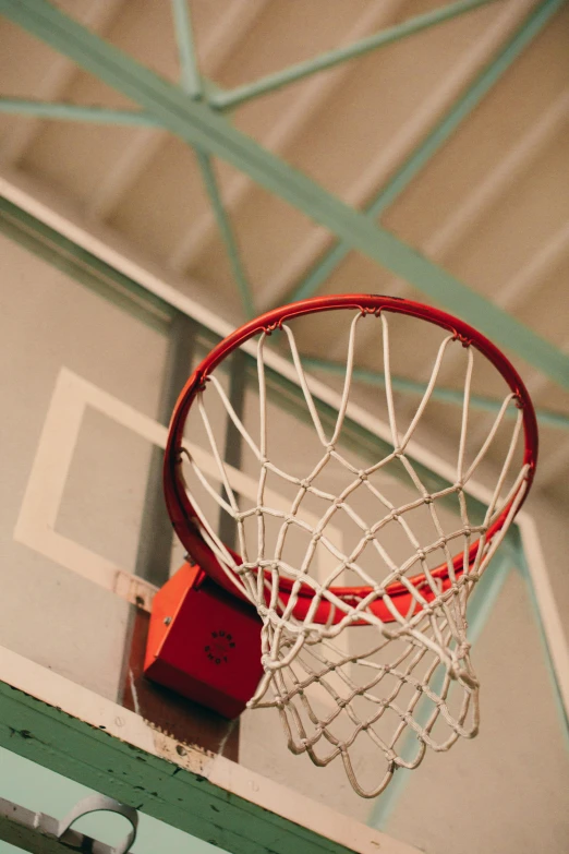 basketball net and backboard inside a home gym