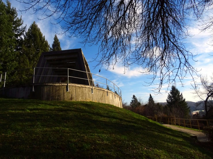 there is a small cement structure on top of the hill