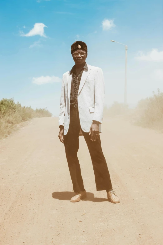 a man is standing on the road while wearing a tie