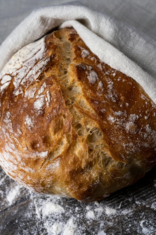 a loaf of bread is sitting on a wooden table