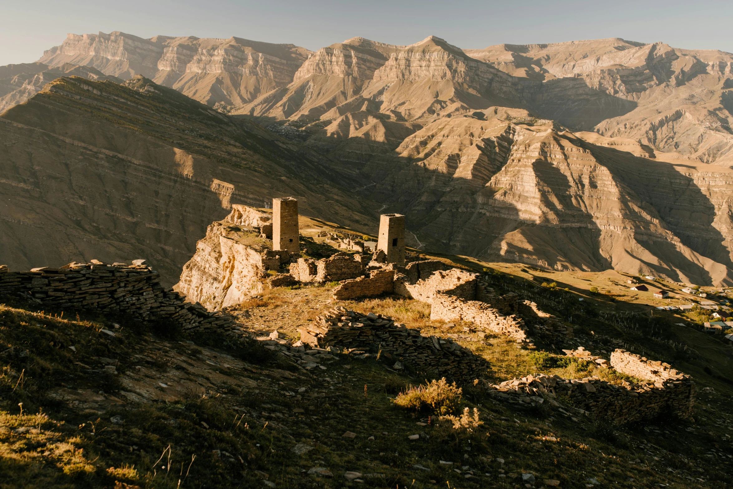 an ancient rock structure sitting on the side of a mountain